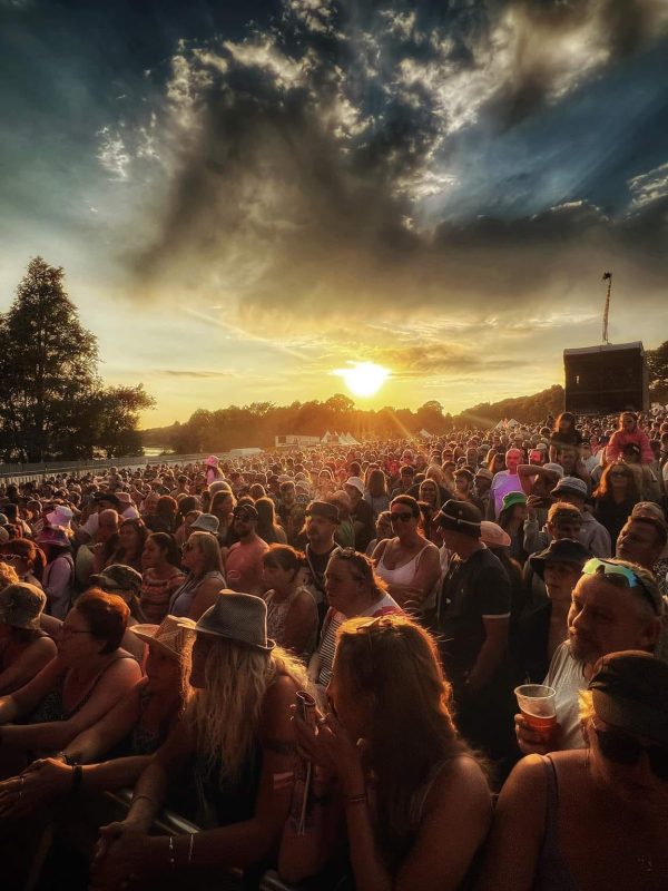 Festival crowd at sunset